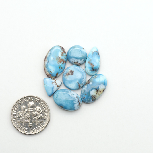 Discover the beauty of Natural Golden Hills Turquoise—prized for its icy blue tones, golden matrix, and exceptional quality. Ideal for artisan jewelry designs.