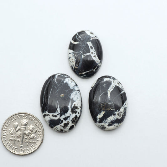 Natural White Buffalo Stone Cabochons are semi-precious gemstones cut into shapes ideal for jewelry-making, making them an excellent choice for artisans.