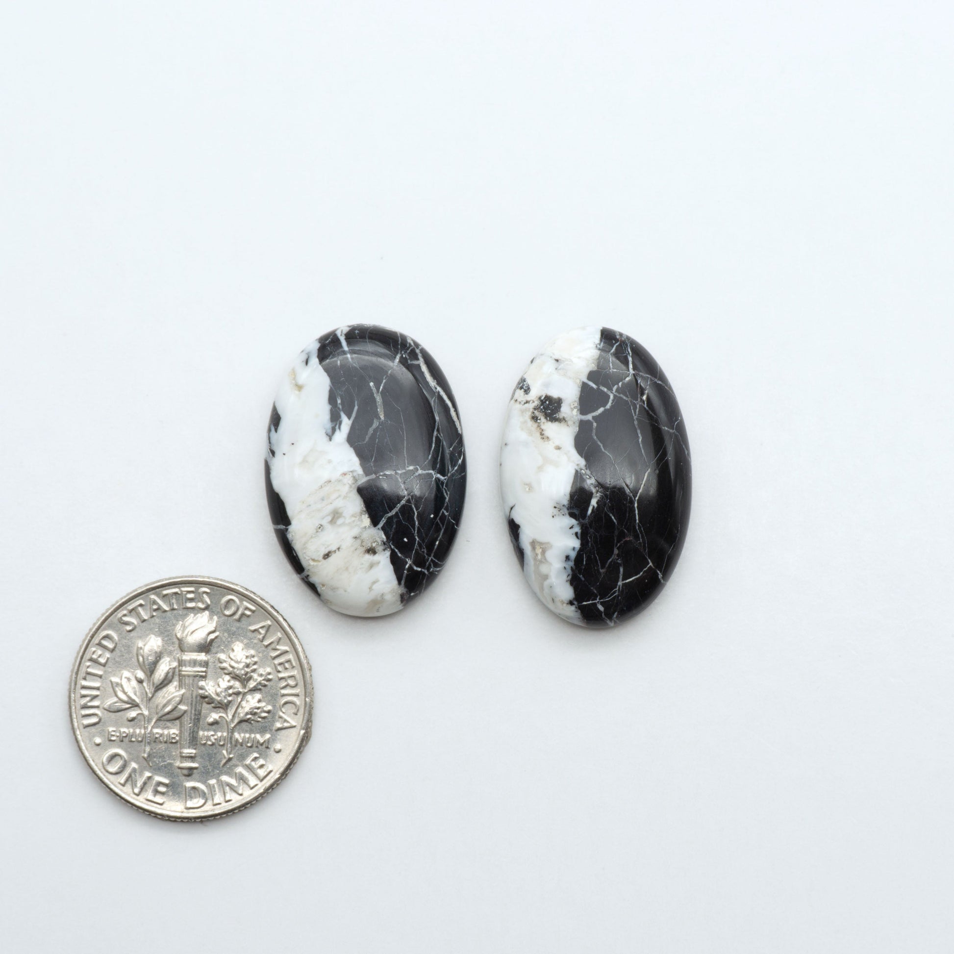 Natural White Buffalo Stone Cabochons are semi-precious gemstones cut into shapes ideal for jewelry-making, making them an excellent choice for artisans.