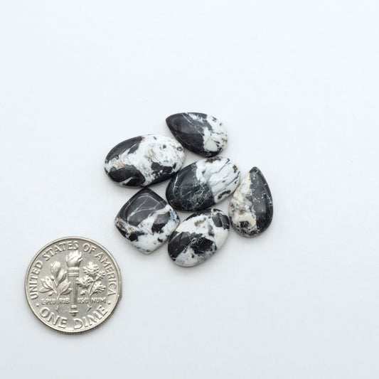Natural White Buffalo Stone Cabochons are semi-precious gemstones cut into shapes ideal for jewelry-making, making them an excellent choice for artisans.