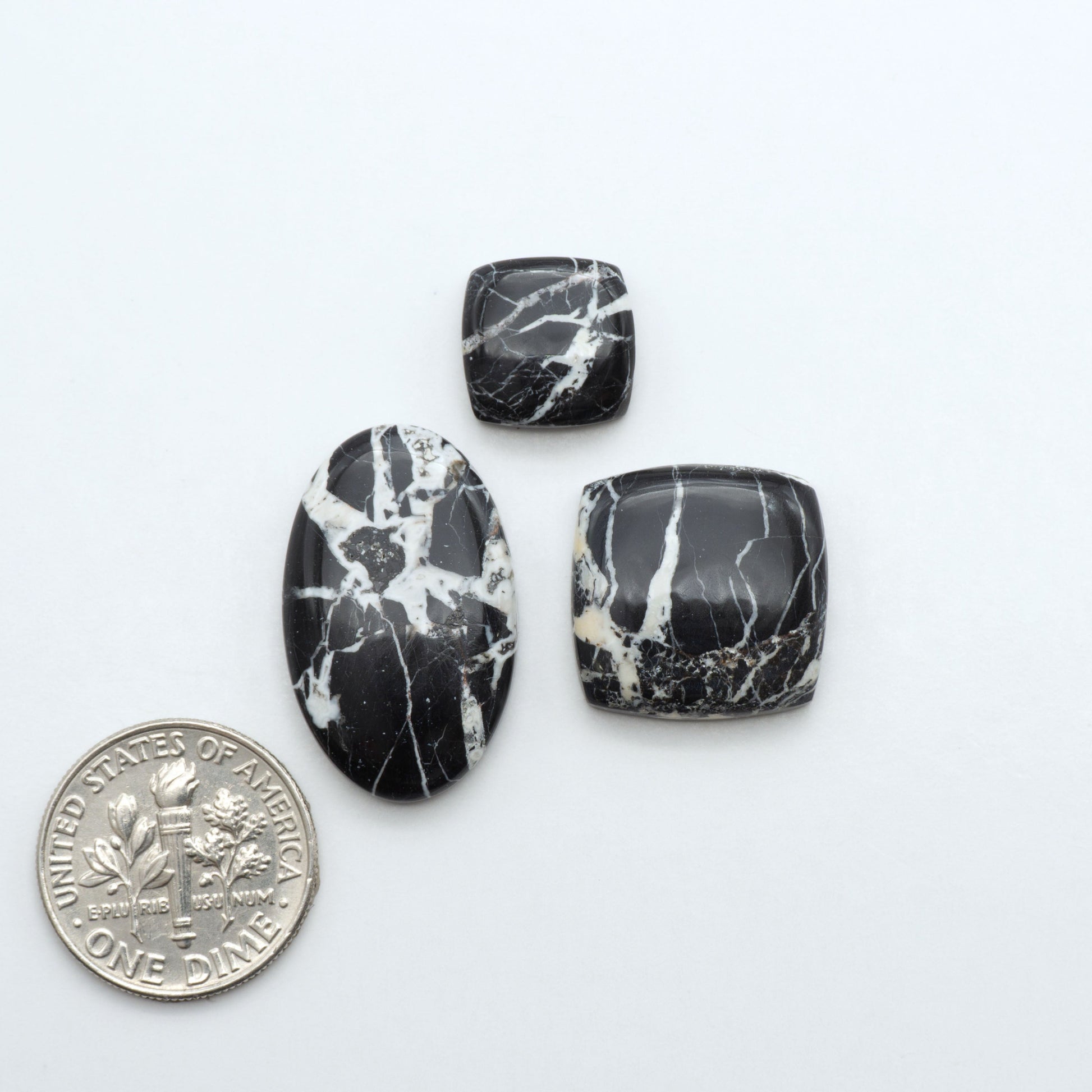 Natural White Buffalo Stone Cabochons are semi-precious gemstones cut into shapes ideal for jewelry-making, making them an excellent choice for artisans.
