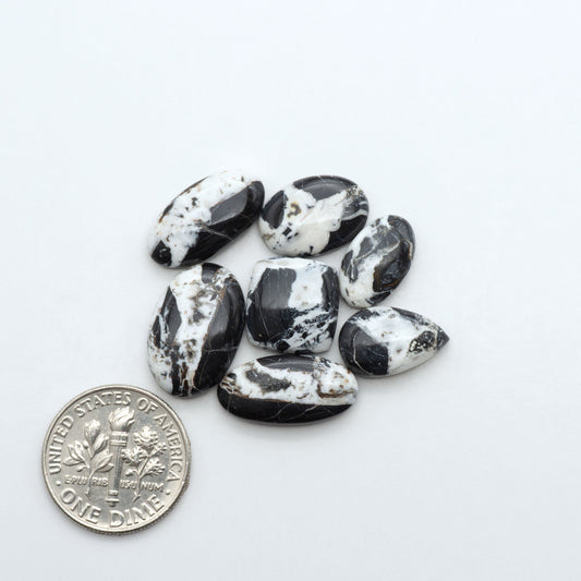 Natural White Buffalo Stone Cabochons are semi-precious gemstones cut into shapes ideal for jewelry-making, making them an excellent choice for artisans.