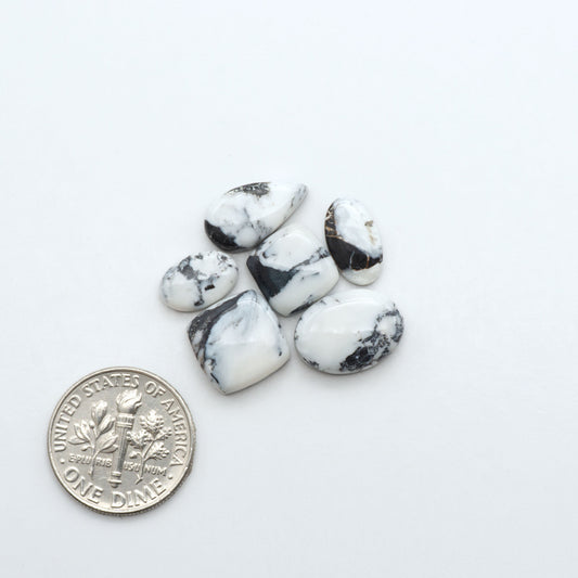 Natural White Buffalo Stone Cabochons are semi-precious gemstones cut into shapes ideal for jewelry-making, making them an excellent choice for artisans.