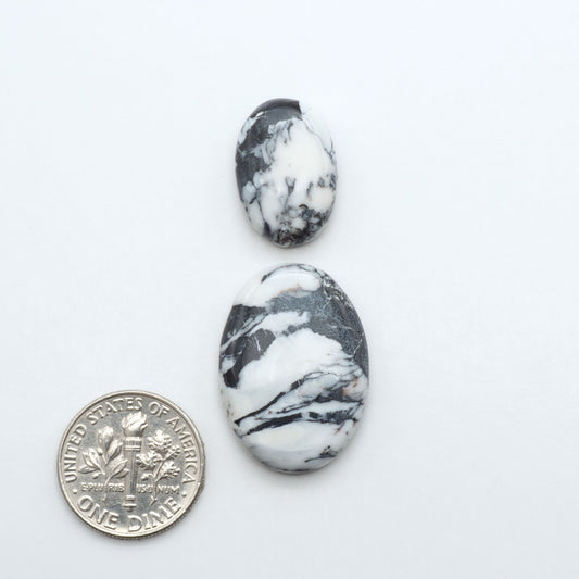 Natural White Buffalo Stone Cabochons are semi-precious gemstones cut into shapes ideal for jewelry-making, making them an excellent choice for artisans.