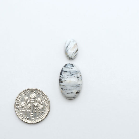 Natural White Buffalo Stone Cabochons are semi-precious gemstones cut into shapes ideal for jewelry-making, making them an excellent choice for artisans.