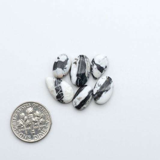 Natural White Buffalo Stone Cabochons are semi-precious gemstones cut into shapes ideal for jewelry-making, making them an excellent choice for artisans.