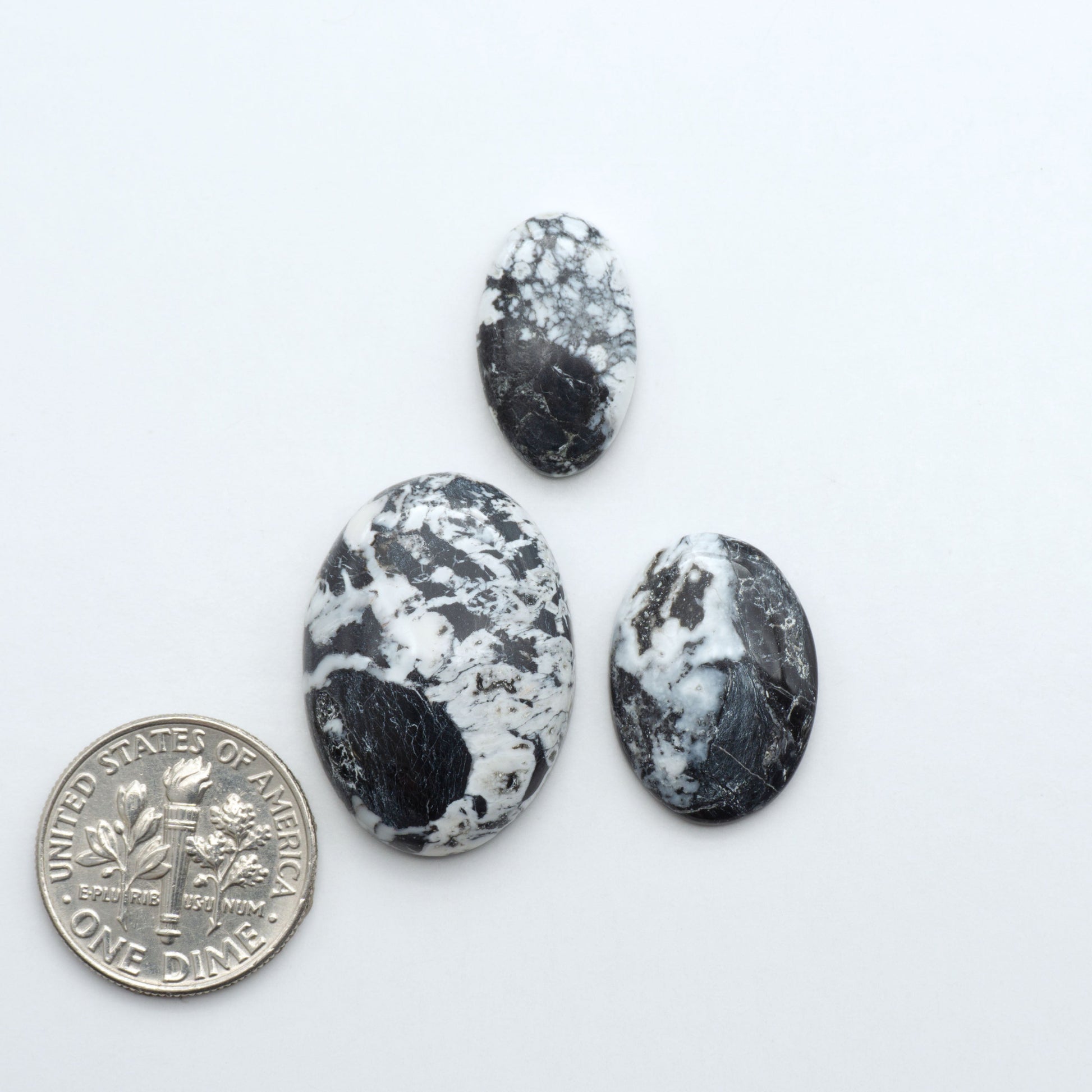 Natural White Buffalo Stone Cabochons are semi-precious gemstones cut into shapes ideal for jewelry-making, making them an excellent choice for artisans.