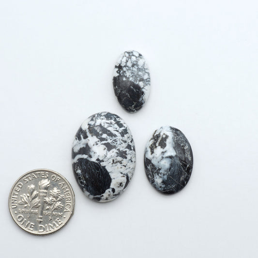 Natural White Buffalo Stone Cabochons are semi-precious gemstones cut into shapes ideal for jewelry-making, making them an excellent choice for artisans.