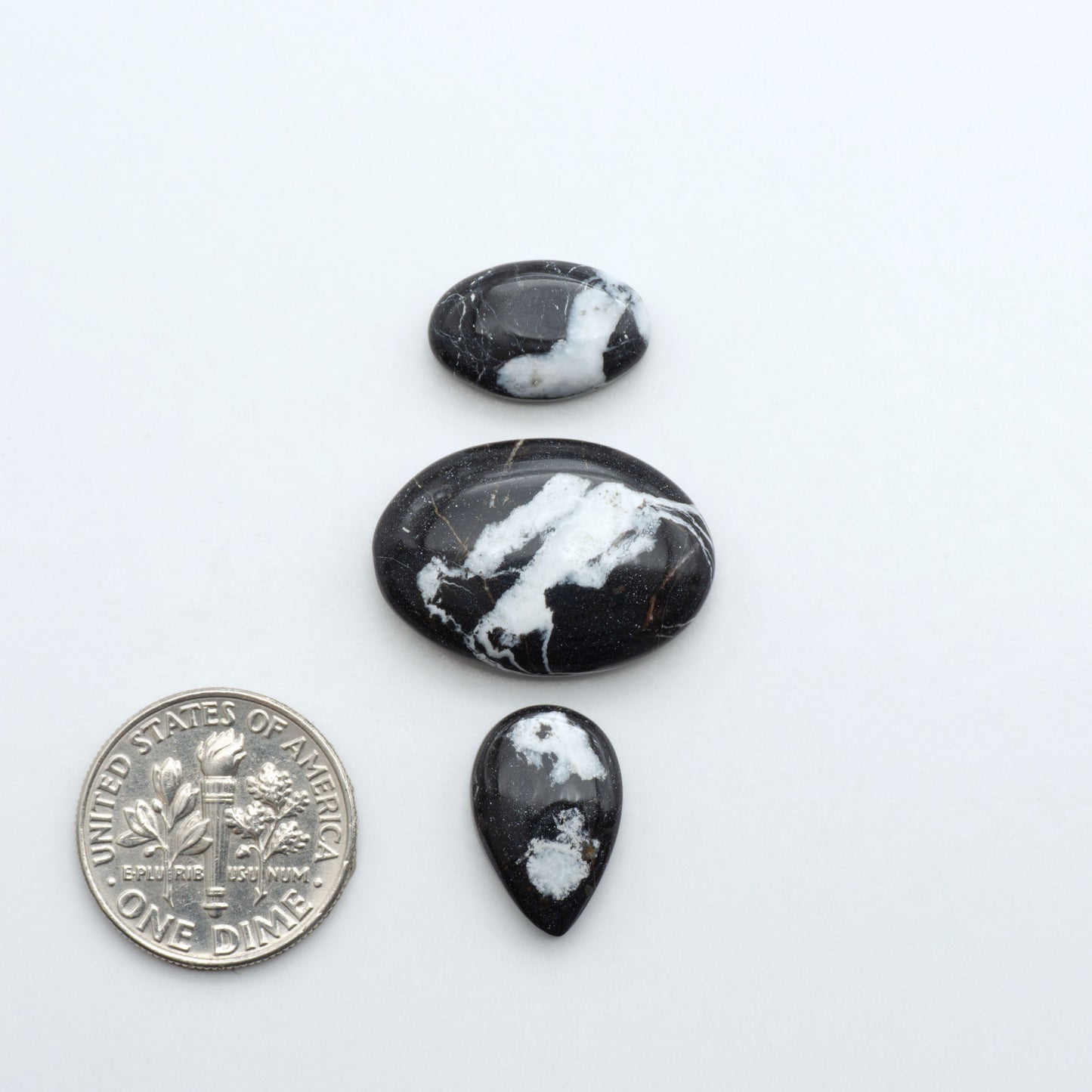Natural White Buffalo Stone Cabochons are semi-precious gemstones cut into shapes ideal for jewelry-making, making them an excellent choice for artisans.