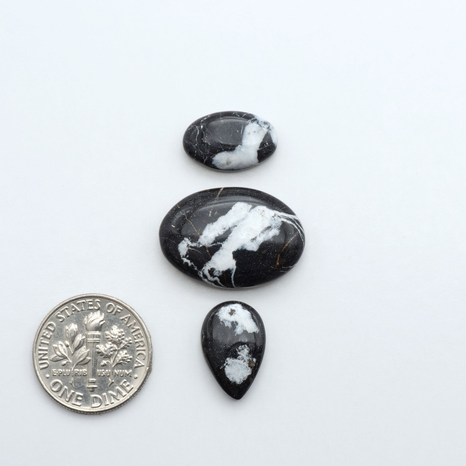 Natural White Buffalo Stone Cabochons are semi-precious gemstones cut into shapes ideal for jewelry-making, making them an excellent choice for artisans.
