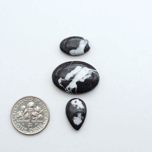 Natural White Buffalo Stone Cabochons are semi-precious gemstones cut into shapes ideal for jewelry-making, making them an excellent choice for artisans.