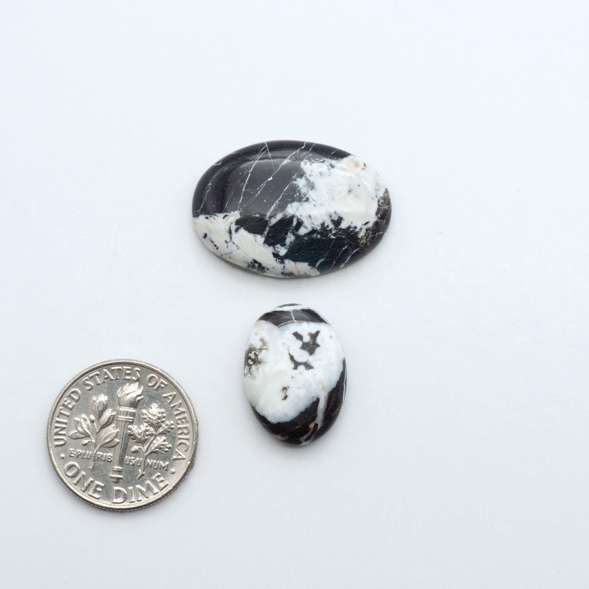 Natural White Buffalo Stone Cabochons are semi-precious gemstones cut into shapes ideal for jewelry-making, making them an excellent choice for artisans.