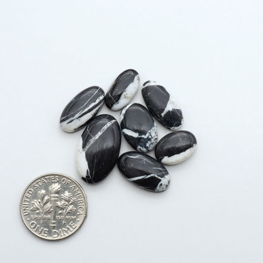 Natural White Buffalo Stone Cabochons are semi-precious gemstones cut into shapes ideal for jewelry-making, making them an excellent choice for artisans.