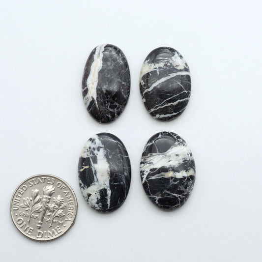 Natural White Buffalo Stone Cabochons are semi-precious gemstones cut into shapes ideal for jewelry-making, making them an excellent choice for artisans.