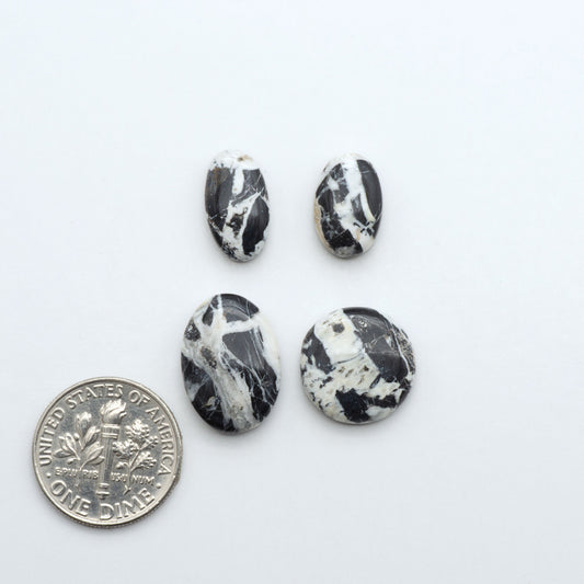 Natural White Buffalo Stone Cabochons are semi-precious gemstones cut into shapes ideal for jewelry-making, making them an excellent choice for artisans.