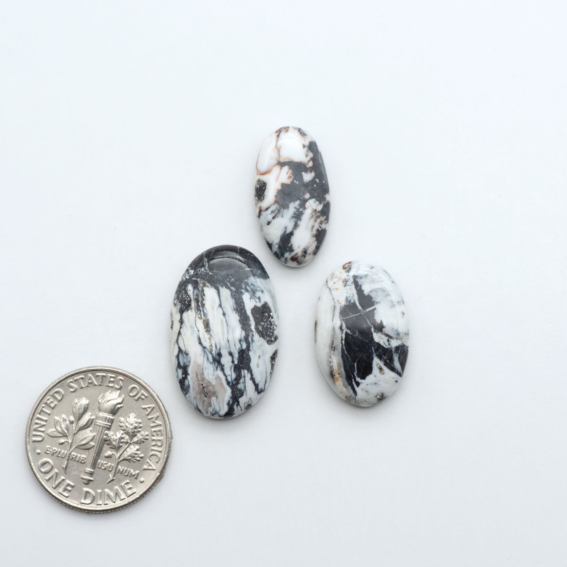 Natural White Buffalo Stone Cabochons are semi-precious gemstones cut into shapes ideal for jewelry-making, making them an excellent choice for artisans.