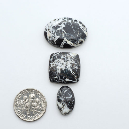 Natural White Buffalo Stone Cabochons are semi-precious gemstones cut into shapes ideal for jewelry-making, making them an excellent choice for artisans.