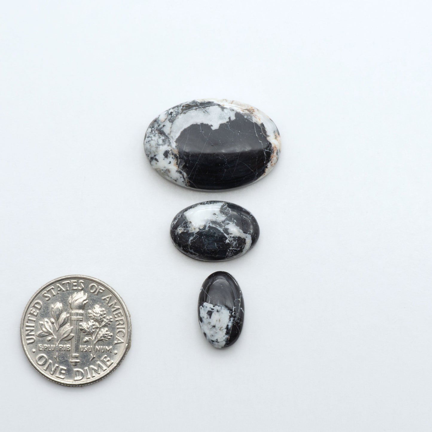Natural White Buffalo Stone Cabochons are semi-precious gemstones cut into shapes ideal for jewelry-making, making them an excellent choice for artisans.