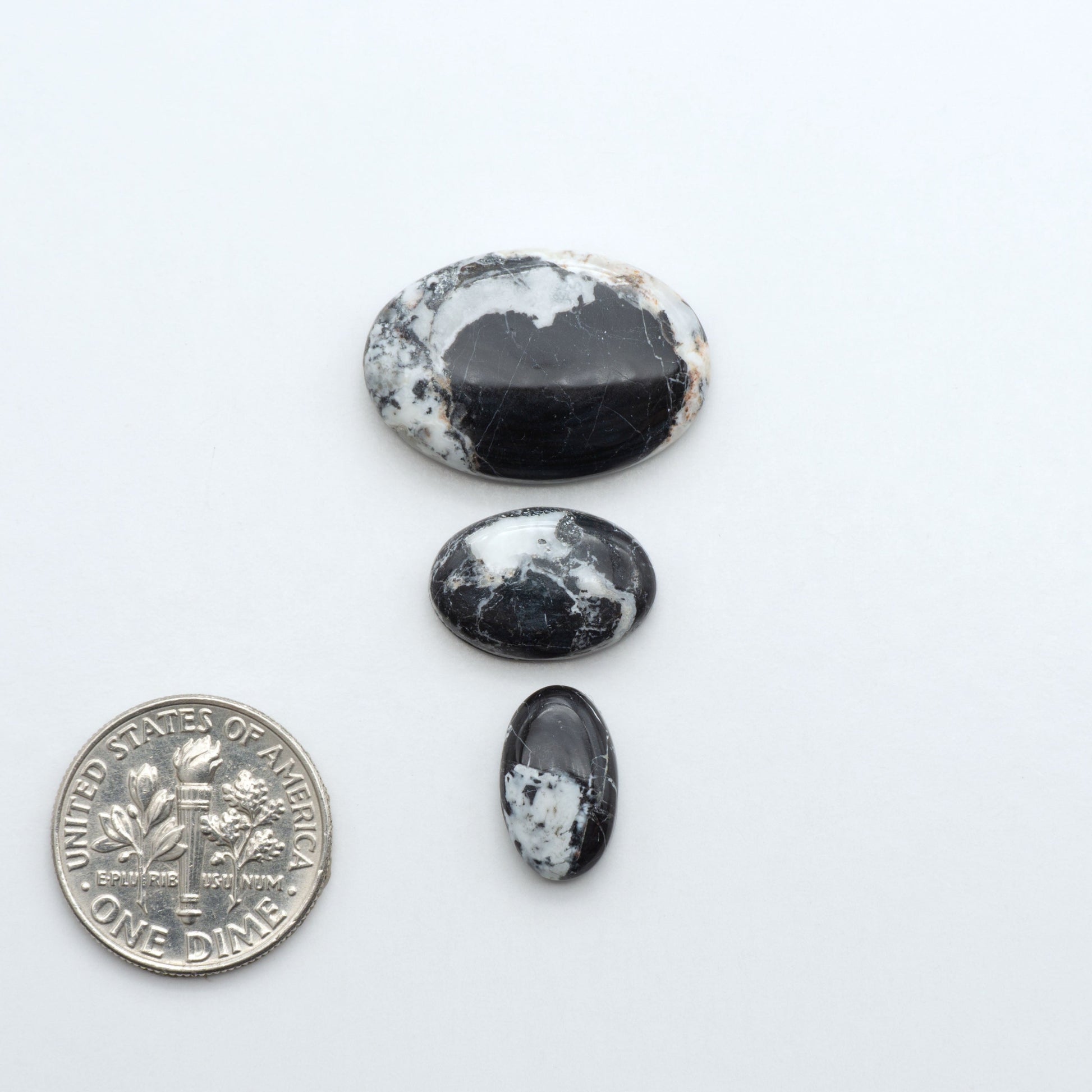 Natural White Buffalo Stone Cabochons are semi-precious gemstones cut into shapes ideal for jewelry-making, making them an excellent choice for artisans.