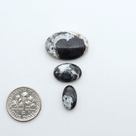 Natural White Buffalo Stone Cabochons are semi-precious gemstones cut into shapes ideal for jewelry-making, making them an excellent choice for artisans.