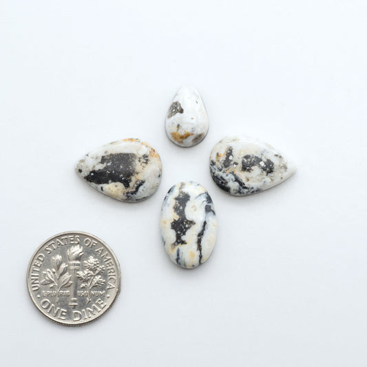 Natural White Buffalo Stone Cabochons are semi-precious gemstones cut into shapes ideal for jewelry-making, making them an excellent choice for artisans.