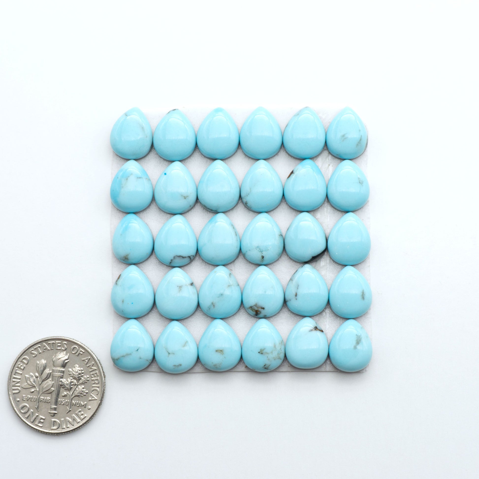 Enhance your jewelry designs with Pressed Turquoise Nugget Cabochons. Crafted from composite materials they add a captivating touch to your creations.