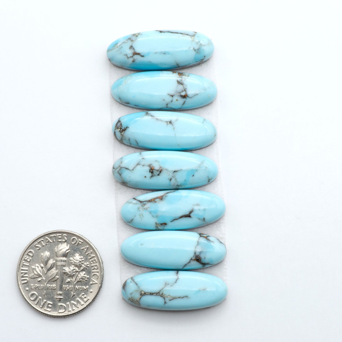 Enhance your jewelry designs with Pressed Turquoise Nugget Cabochons. Crafted from composite materials they add a captivating touch to your creations.