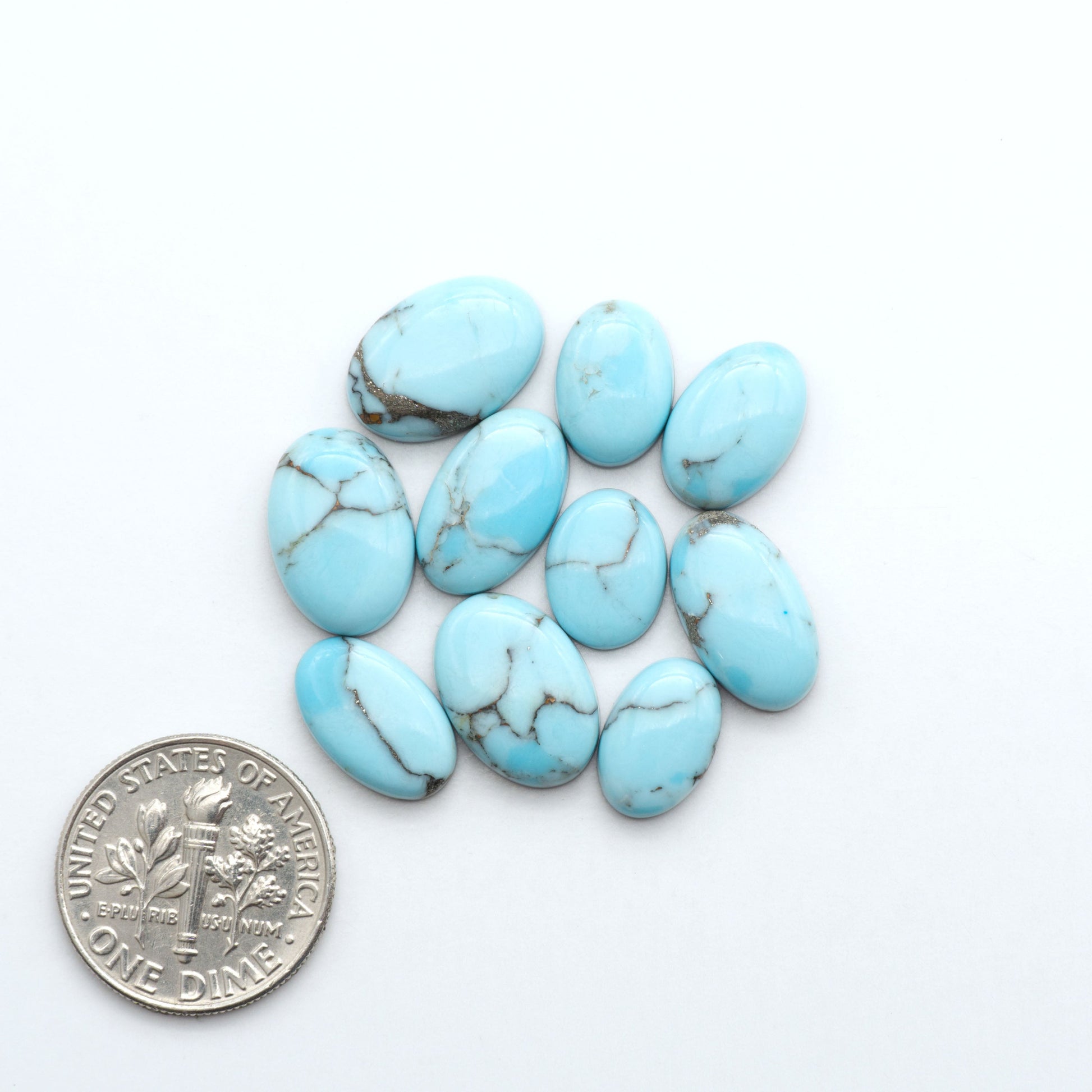 Enhance your jewelry designs with Pressed Turquoise Nugget Cabochons. Crafted from composite materials they add a captivating touch to your creations.
