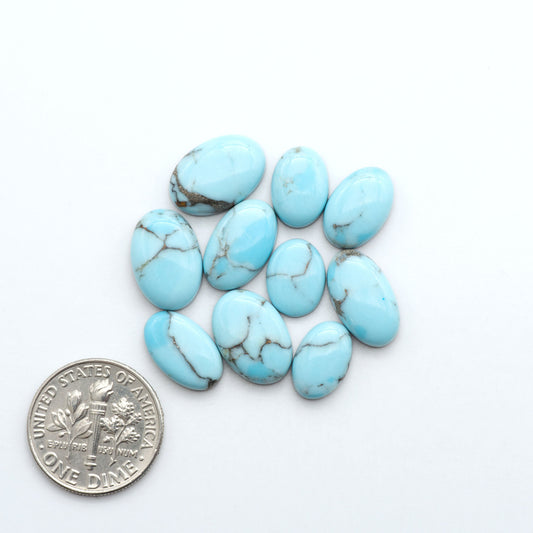 Enhance your jewelry designs with Pressed Turquoise Nugget Cabochons. Crafted from composite materials they add a captivating touch to your creations.