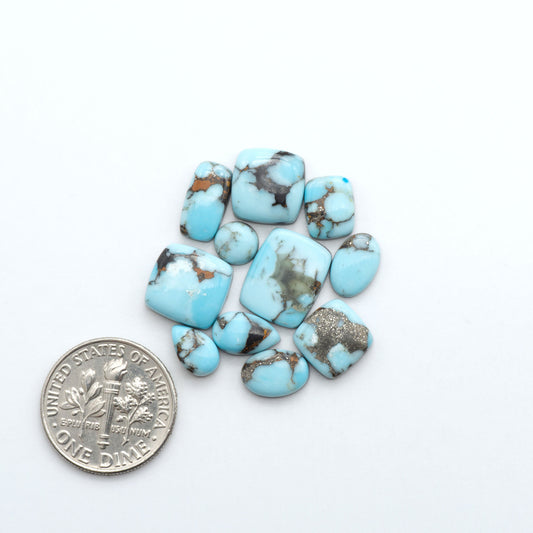 Enhance your jewelry designs with Pressed Turquoise Nugget Cabochons. Crafted from composite materials they add a captivating touch to your creations.