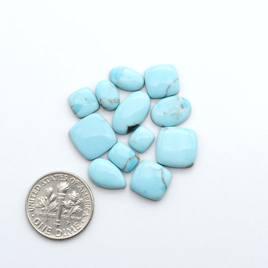 Enhance your jewelry designs with Pressed Turquoise Nugget Cabochons. Crafted from composite materials they add a captivating touch to your creations.