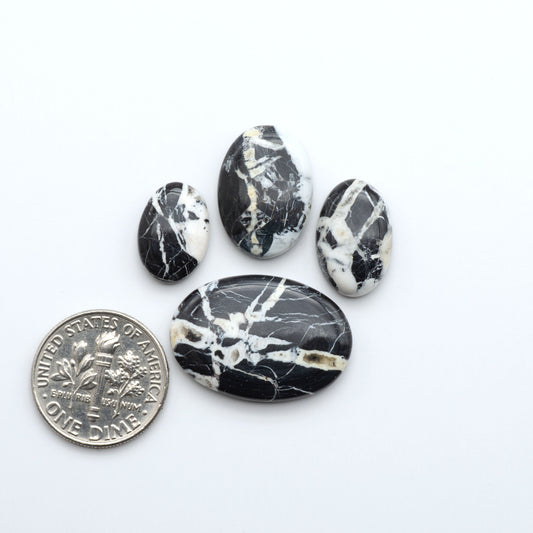 Natural White Buffalo Stone Cabochons are semi-precious gemstones cut into shapes ideal for jewelry-making, making them an excellent choice for artisans.