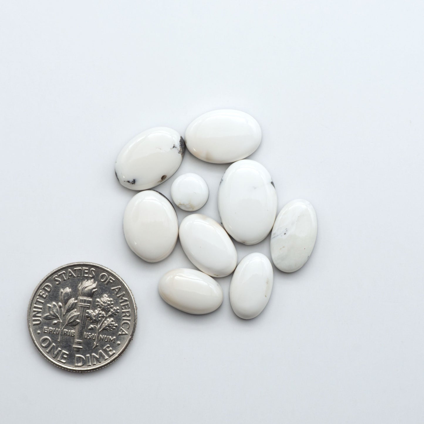 Natural White Buffalo Stone Cabochons are semi-precious gemstones cut into shapes ideal for jewelry-making, making them an excellent choice for artisans.