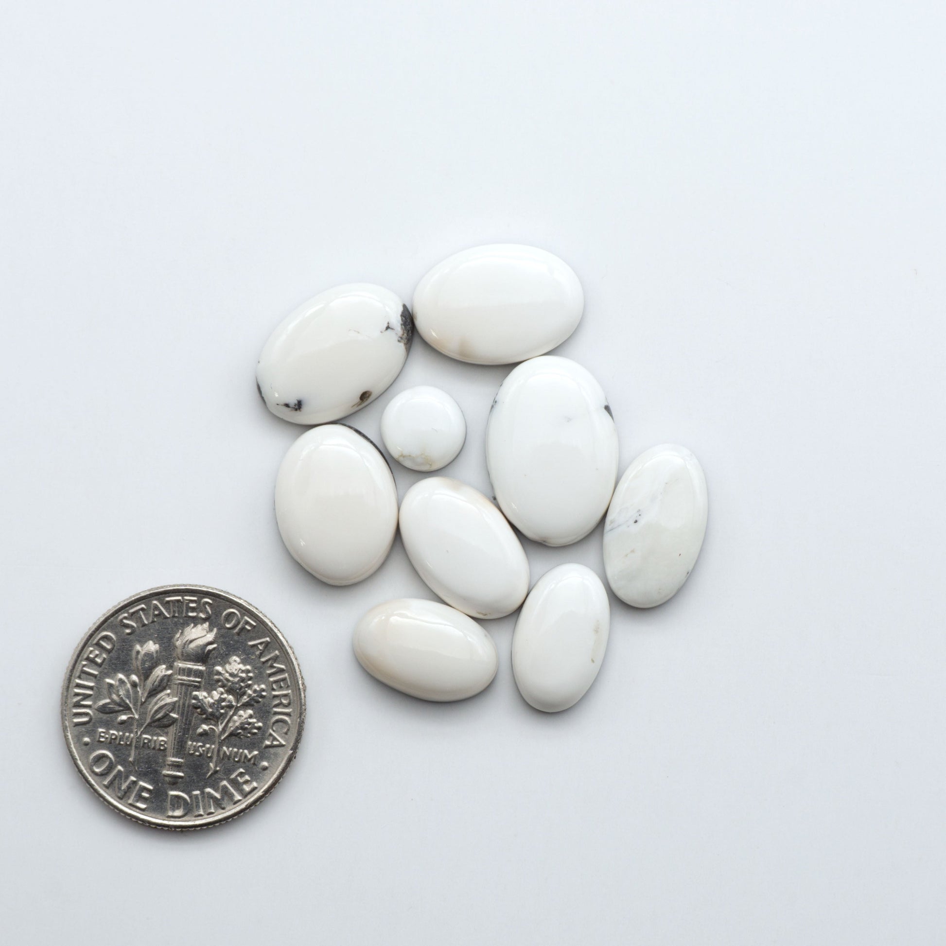 Natural White Buffalo Stone Cabochons are semi-precious gemstones cut into shapes ideal for jewelry-making, making them an excellent choice for artisans.