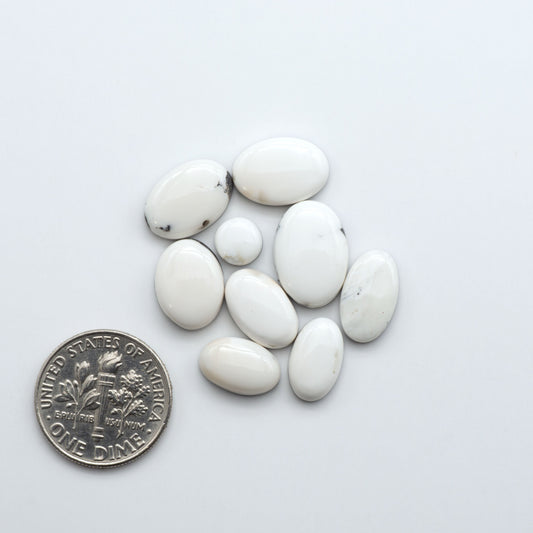 Natural White Buffalo Stone Cabochons are semi-precious gemstones cut into shapes ideal for jewelry-making, making them an excellent choice for artisans.