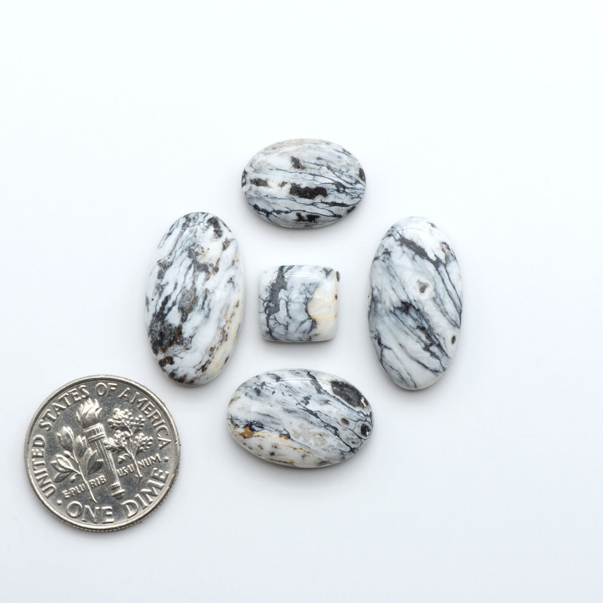 Natural White Buffalo Stone Cabochons are semi-precious gemstones cut into shapes ideal for jewelry-making, making them an excellent choice for artisans.