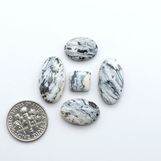 Natural White Buffalo Stone Cabochons are semi-precious gemstones cut into shapes ideal for jewelry-making, making them an excellent choice for artisans.
