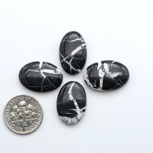 Natural White Buffalo Stone Cabochons are semi-precious gemstones cut into shapes ideal for jewelry-making, making them an excellent choice for artisans.