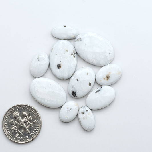 Natural White Buffalo Stone Cabochons are semi-precious gemstones cut into shapes ideal for jewelry-making, making them an excellent choice for artisans.