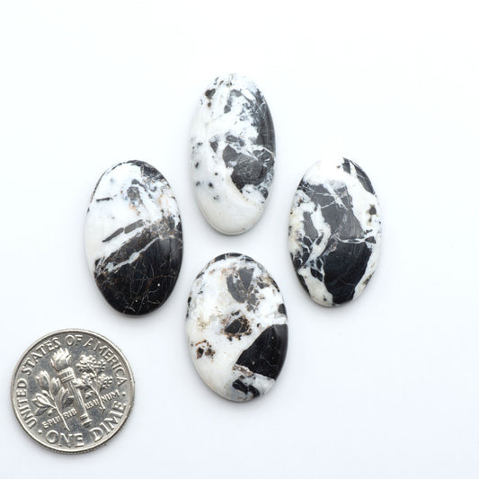 Natural White Buffalo Stone Cabochons are semi-precious gemstones cut into shapes ideal for jewelry-making, making them an excellent choice for artisans.