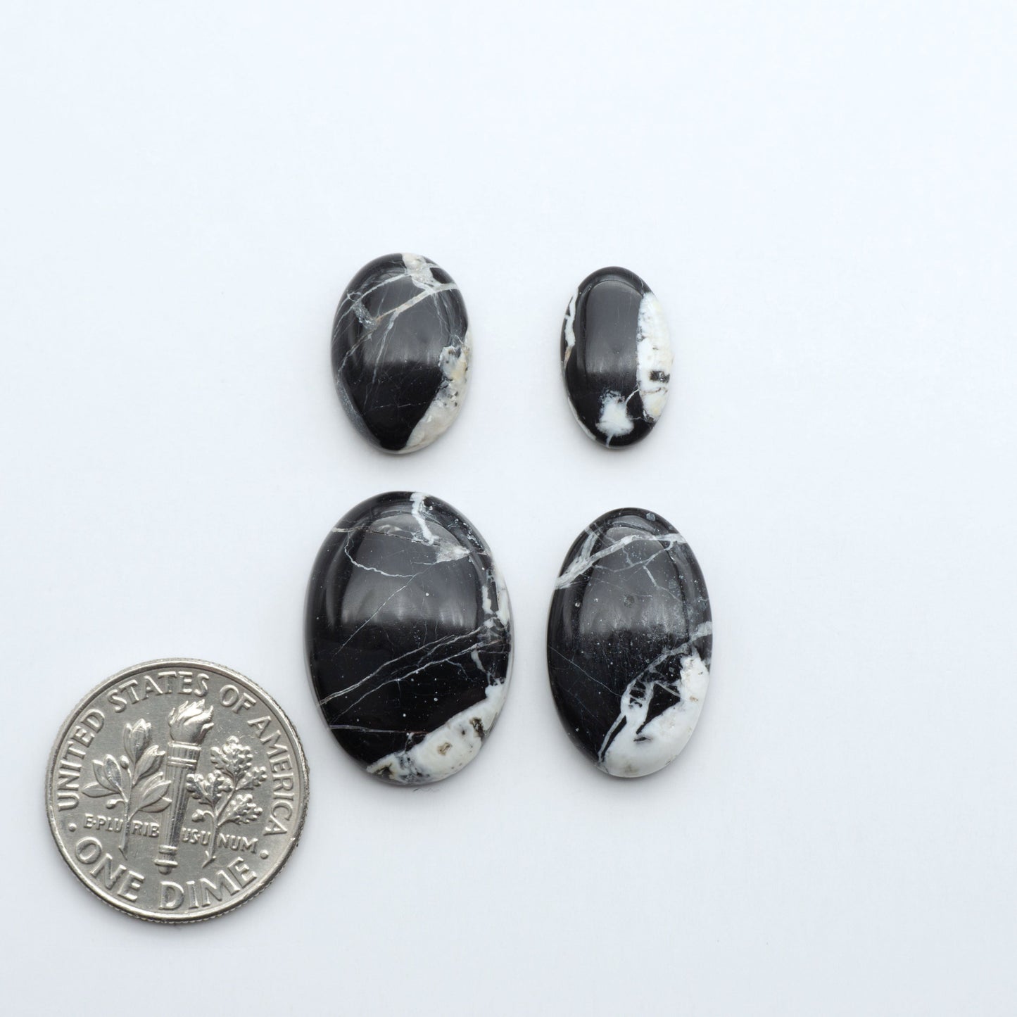 Natural White Buffalo Stone Cabochons are semi-precious gemstones cut into shapes ideal for jewelry-making, making them an excellent choice for artisans.
