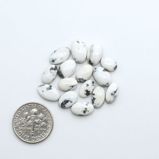 Natural White Buffalo Stone Cabochons are semi-precious gemstones cut into shapes ideal for jewelry-making, making them an excellent choice for artisans.