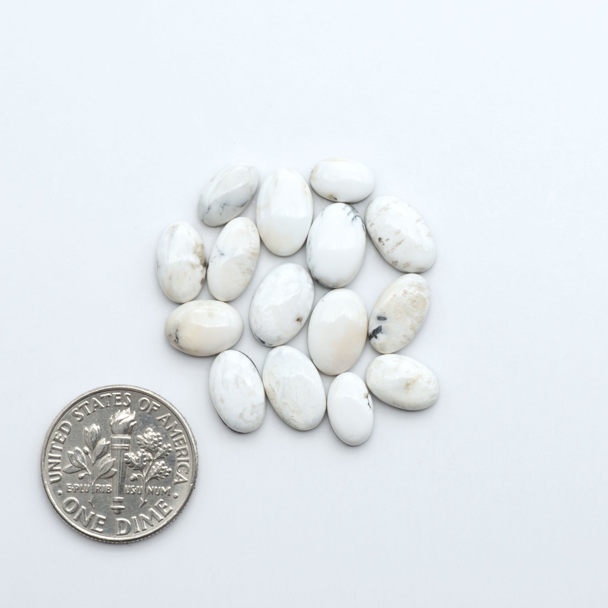 Natural White Buffalo Stone Cabochons are semi-precious gemstones cut into shapes ideal for jewelry-making, making them an excellent choice for artisans.