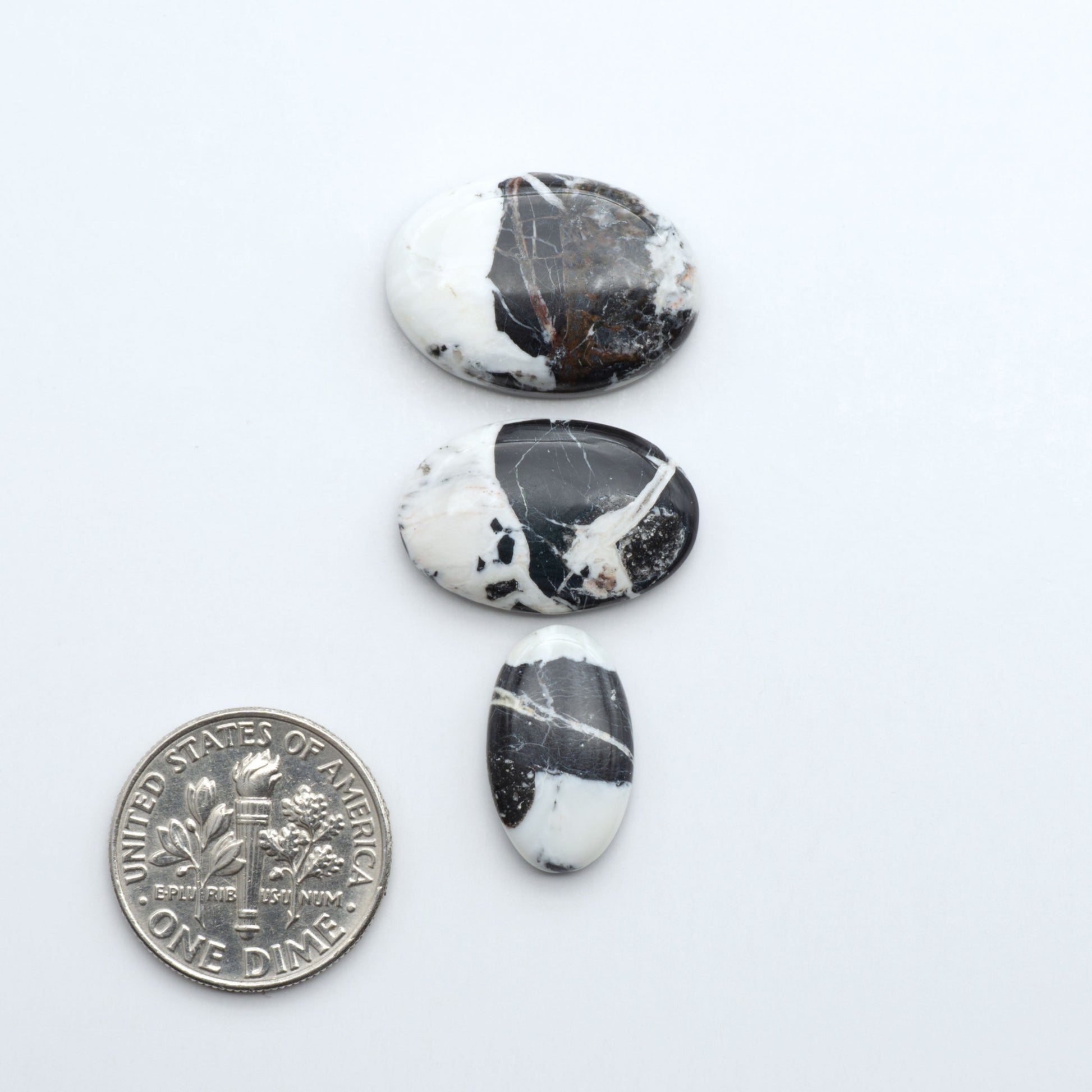 Natural White Buffalo Stone Cabochons are semi-precious gemstones cut into shapes ideal for jewelry-making, making them an excellent choice for artisans.