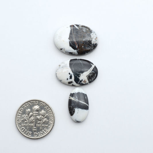 Natural White Buffalo Stone Cabochons are semi-precious gemstones cut into shapes ideal for jewelry-making, making them an excellent choice for artisans.