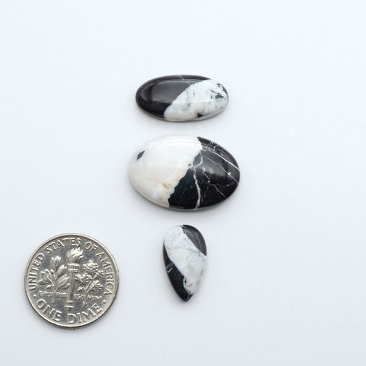 Natural White Buffalo Stone Cabochons are semi-precious gemstones cut into shapes ideal for jewelry-making, making them an excellent choice for artisans.