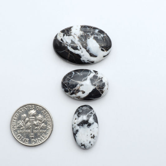 Natural White Buffalo Stone Cabochons are semi-precious gemstones cut into shapes ideal for jewelry-making, making them an excellent choice for artisans.