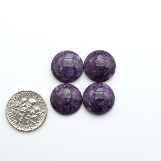 Shop natural Charoite cabochons with vivid violet swirls, perfect for jewelry makers and silversmiths creating rings, pendants, and custom designs.