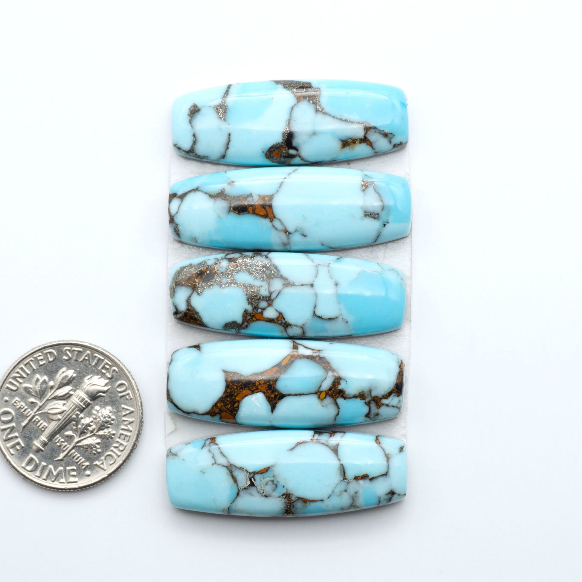 Enhance your jewelry designs with Pressed Turquoise Nugget Cabochons. Crafted from composite materials they add a captivating touch to your creations.