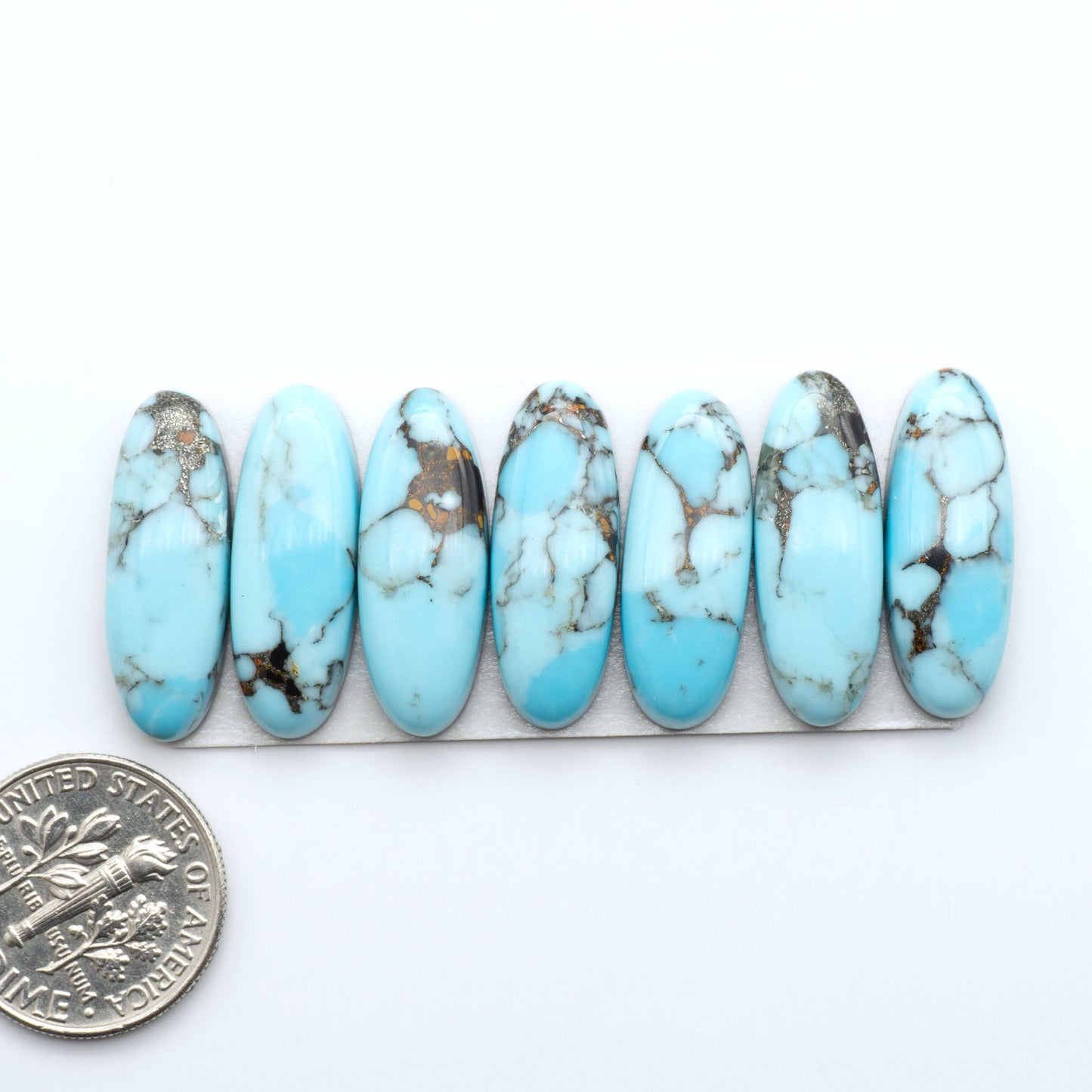 Enhance your jewelry designs with Pressed Turquoise Nugget Cabochons. Crafted from composite materials they add a captivating touch to your creations.